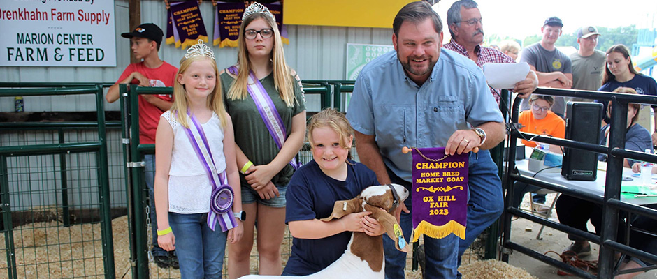 a young girl with her winning market goat