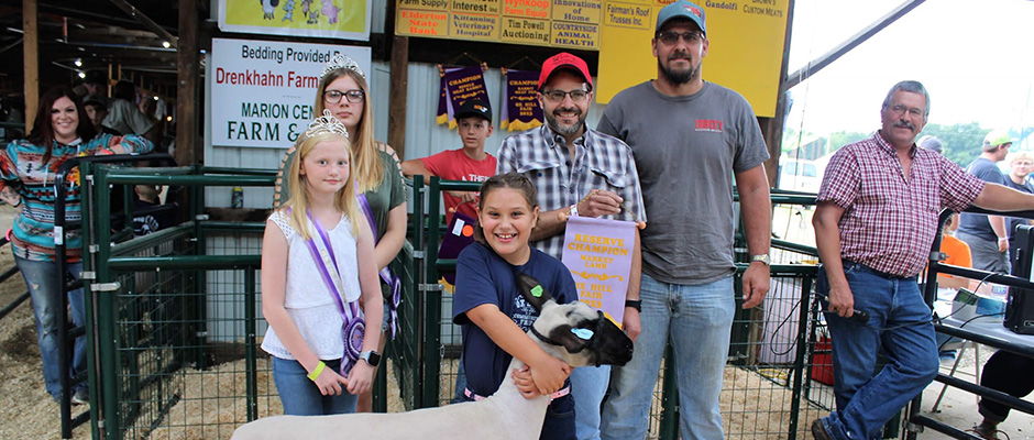 a young girl with her winning market lamb
